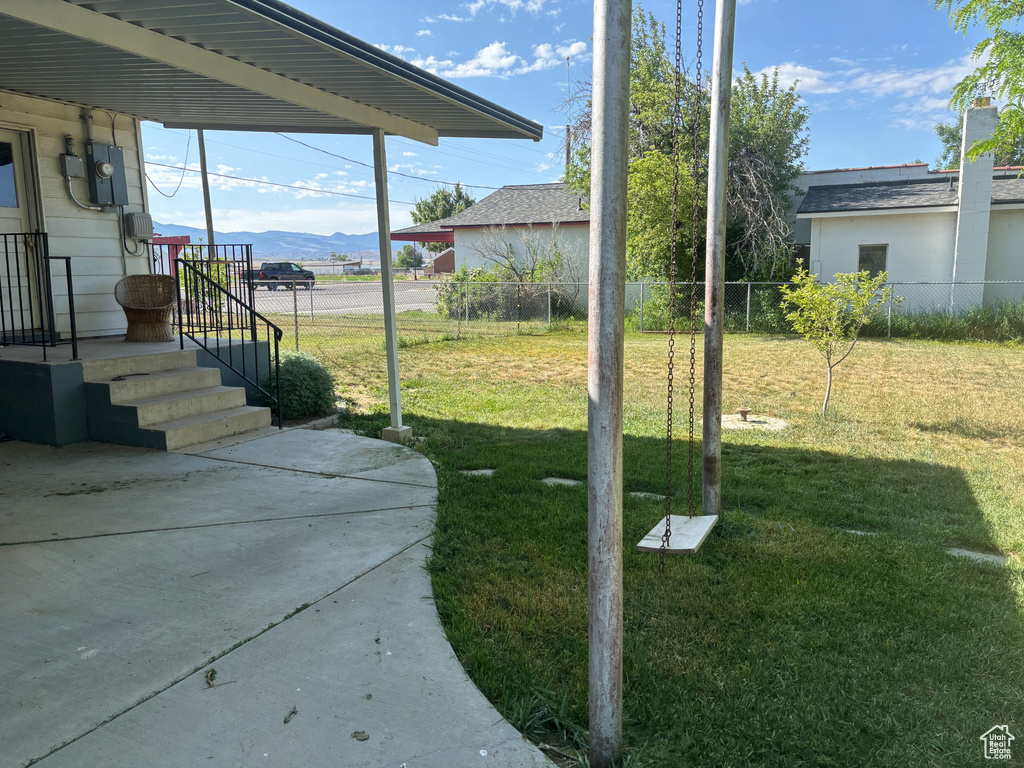 View of yard with a mountain view and a patio