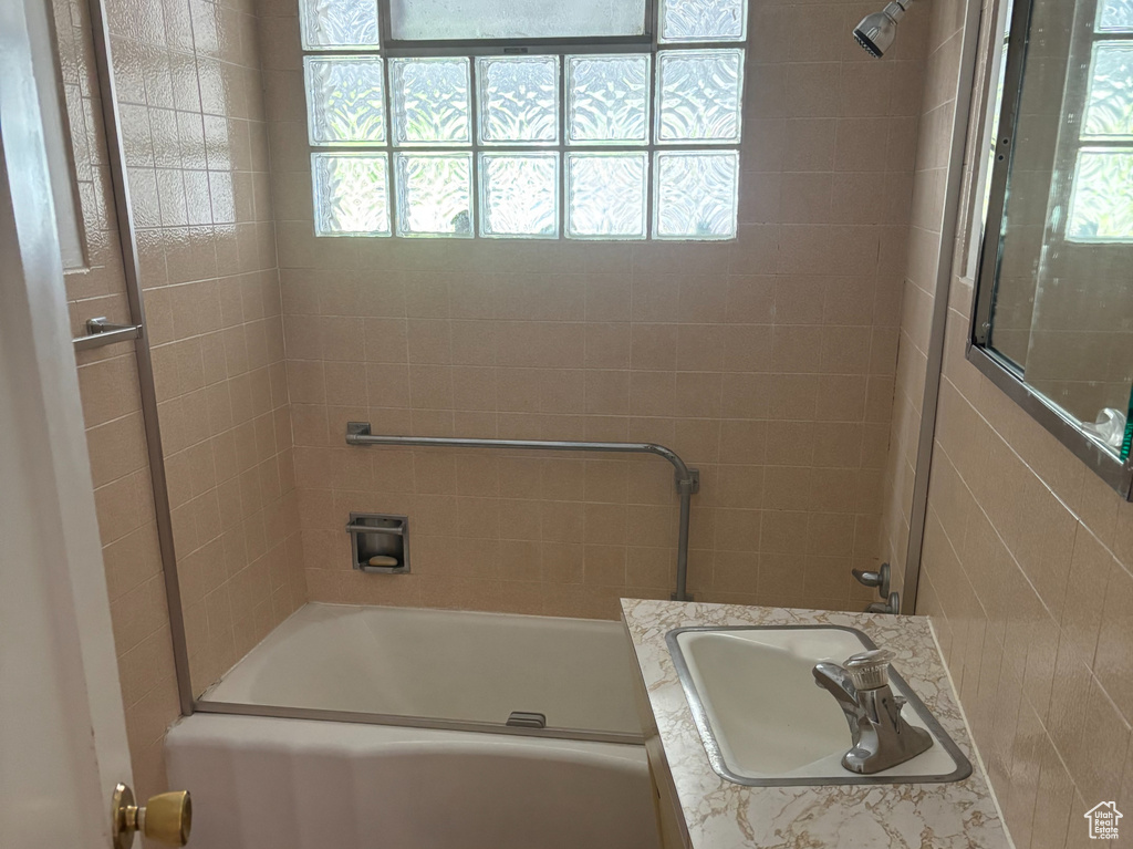 Full bath featuring vanity, shower / bath combination, and tile patterned flooring