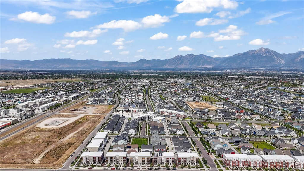 Aerial view of residential area featuring a mountain backdrop