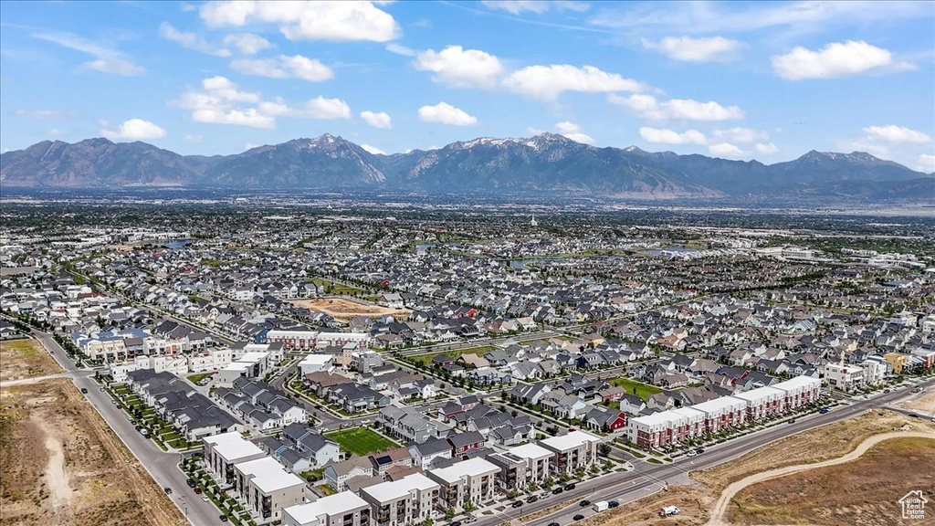 Aerial view of residential area featuring a mountainous background