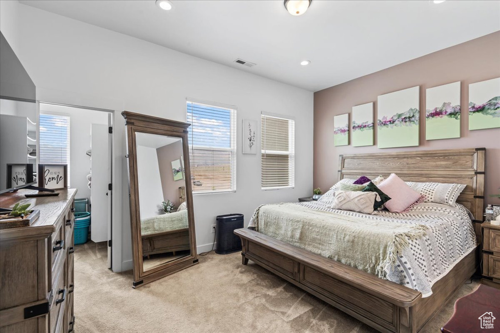 Bedroom featuring light carpet, recessed lighting, and baseboards