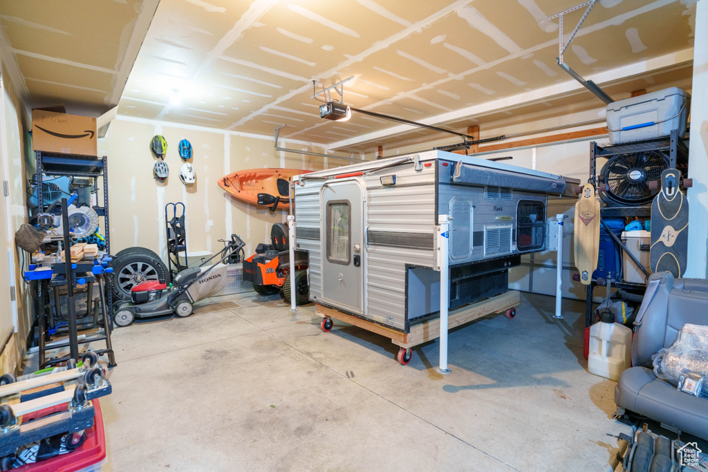 Garage featuring a garage door opener
