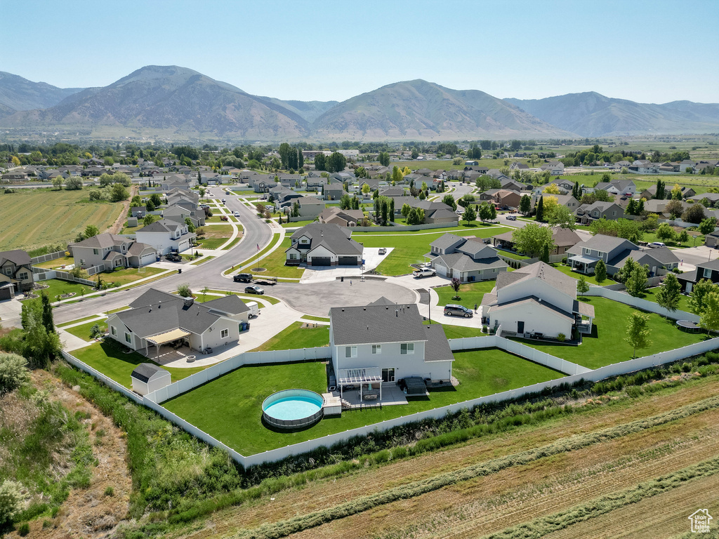 Aerial view of residential area featuring mountains