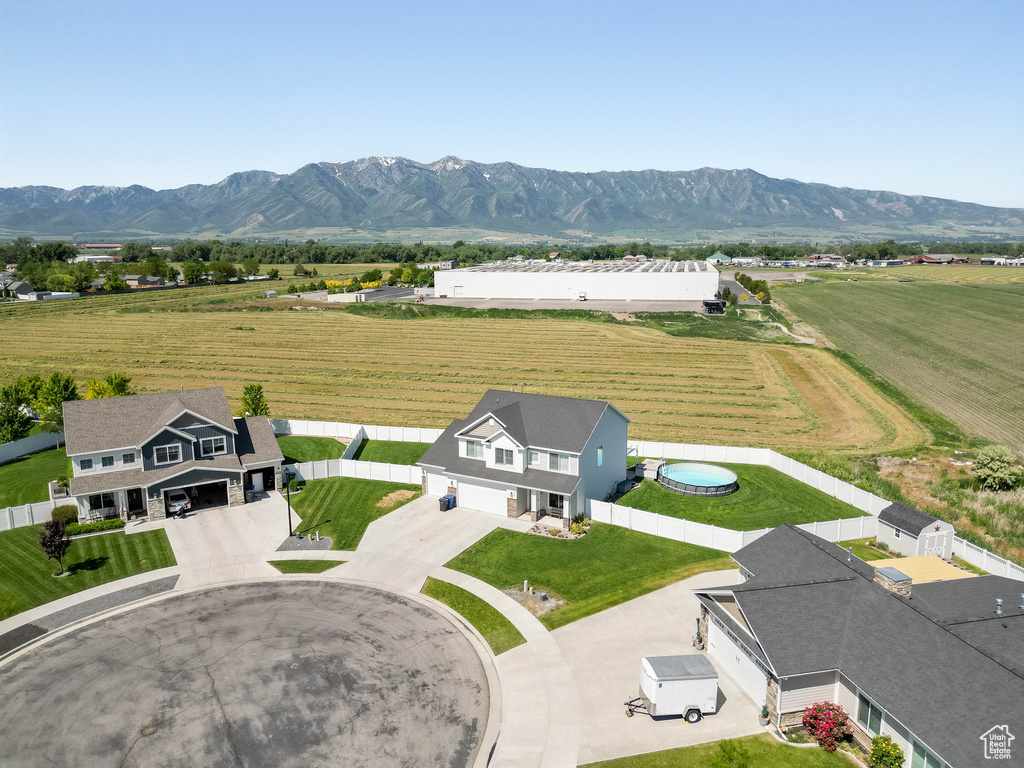 Overview of rural landscape featuring a mountainous background