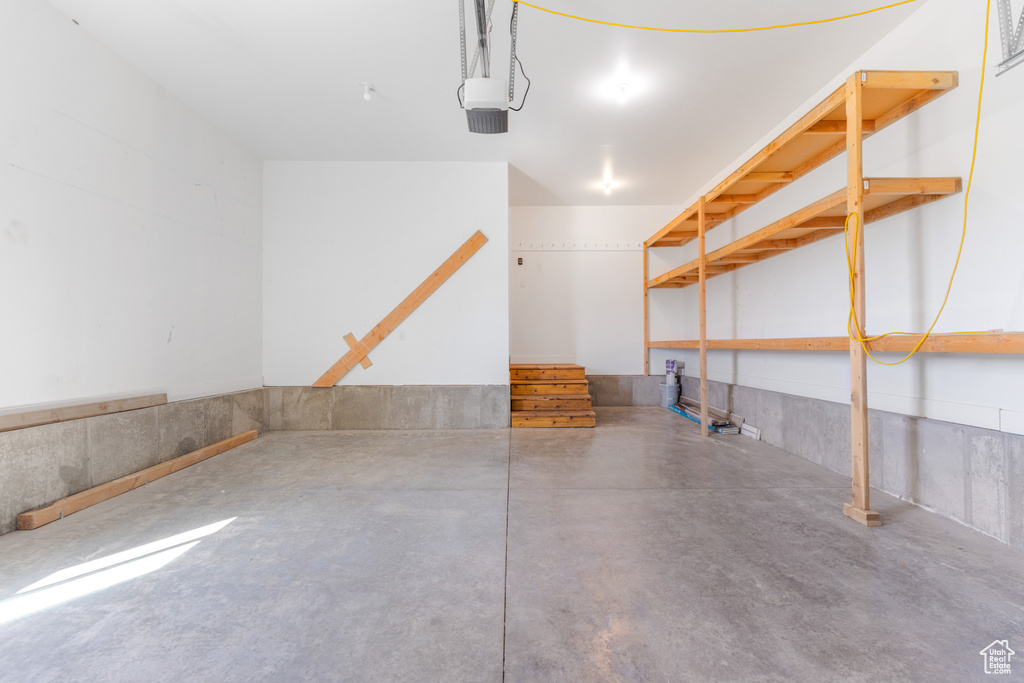 Garage featuring a garage door opener