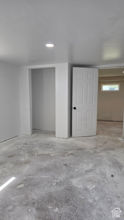 Basement featuring recessed lighting