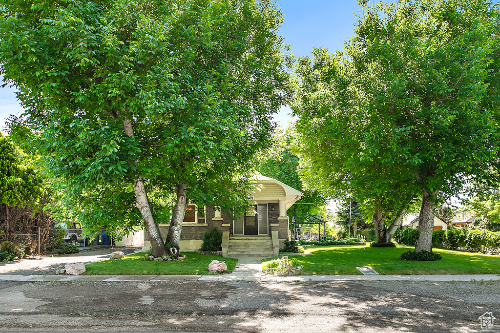 View of property hidden behind natural elements