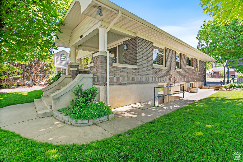 View of property exterior featuring brick siding