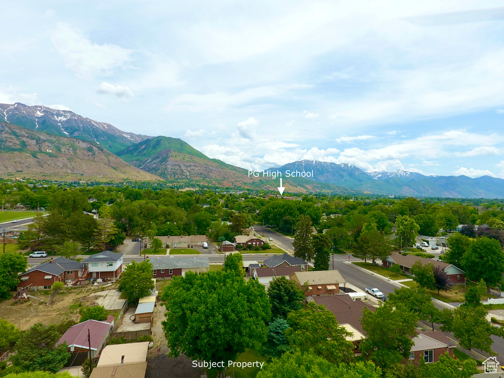 View of mountain background featuring nearby suburban area