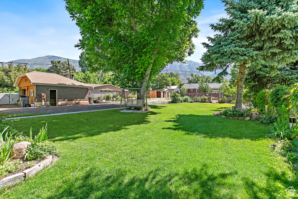 View of green lawn with a mountain view