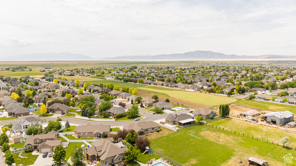 Aerial perspective of suburban area featuring a mountainous background