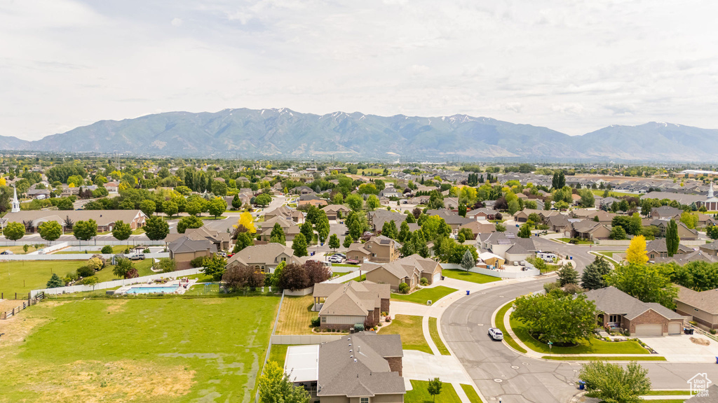 Aerial perspective of suburban area with a mountainous background