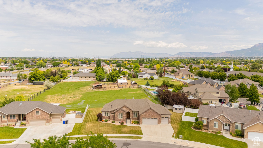 Aerial perspective of suburban area with a mountain backdrop