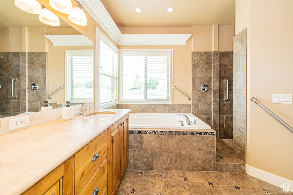 Bathroom with a garden tub, a shower stall, vanity, and recessed lighting