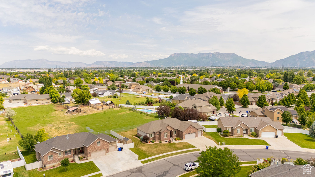 Aerial perspective of suburban area featuring a mountainous background