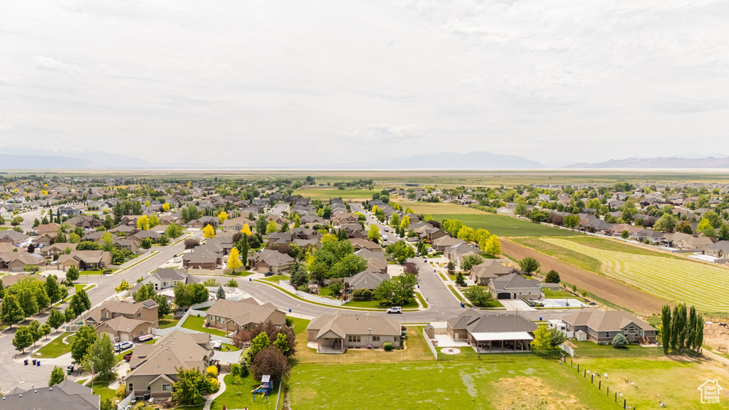 Aerial perspective of suburban area featuring a mountain backdrop