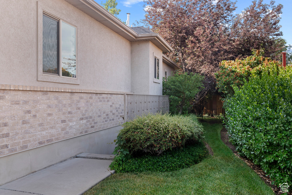 View of side of property featuring stucco siding
