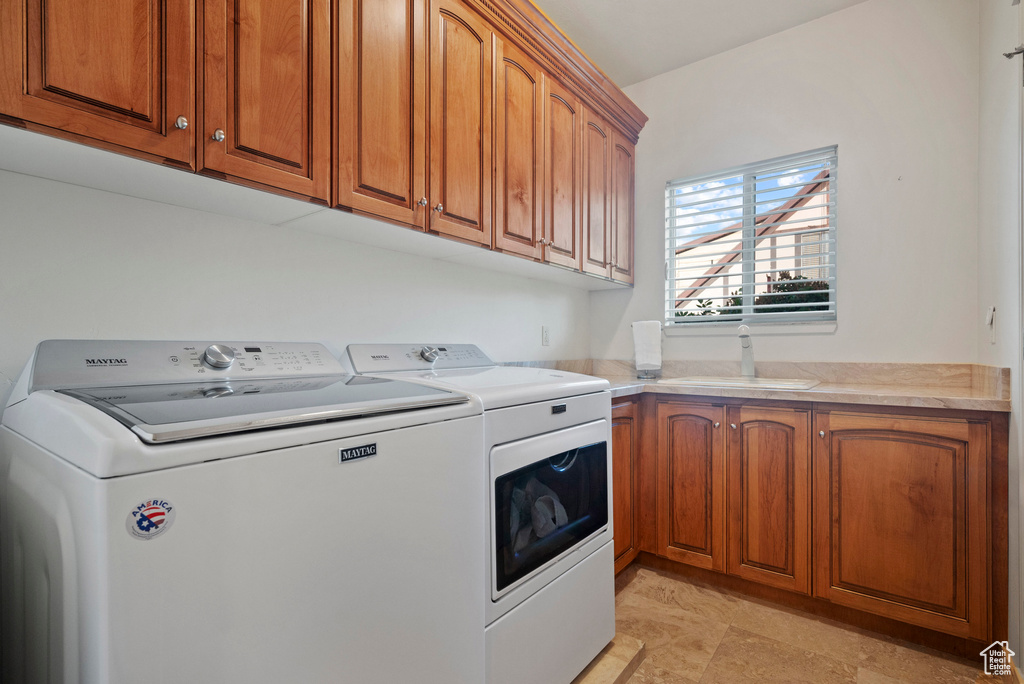 Laundry area with washing machine and dryer and cabinet space