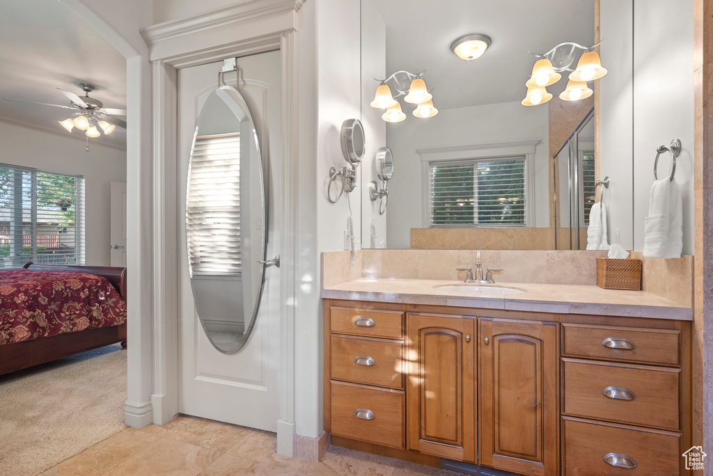 Full bathroom with ensuite bathroom, vanity, and a ceiling fan