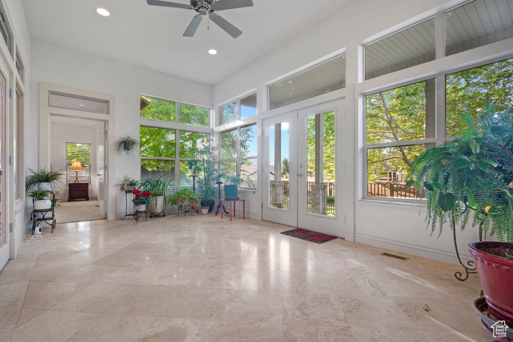 Sunroom with french doors and recessed lighting