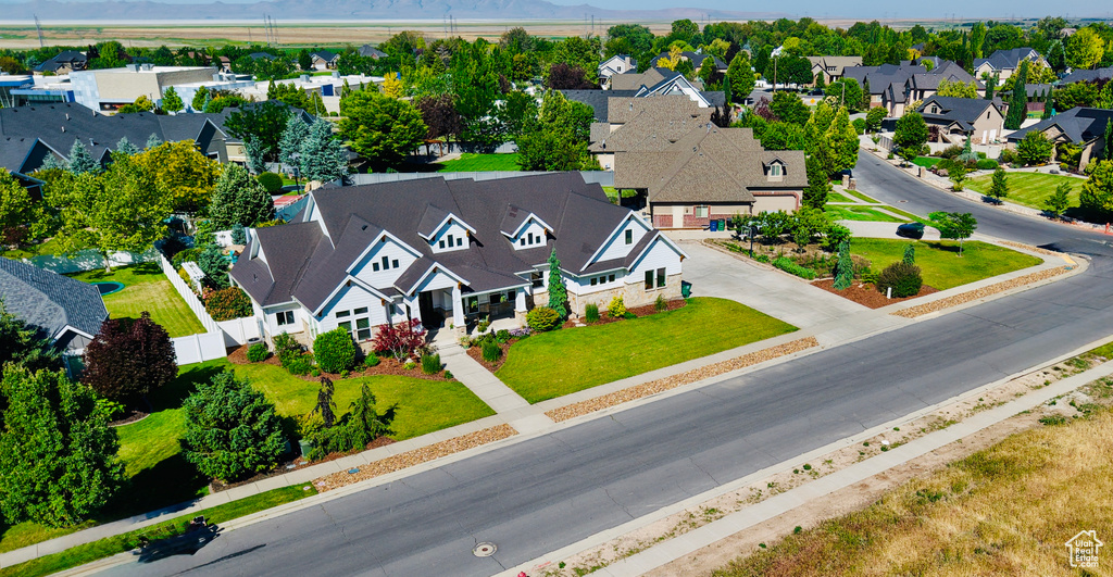 Aerial perspective of suburban area with a mountain backdrop