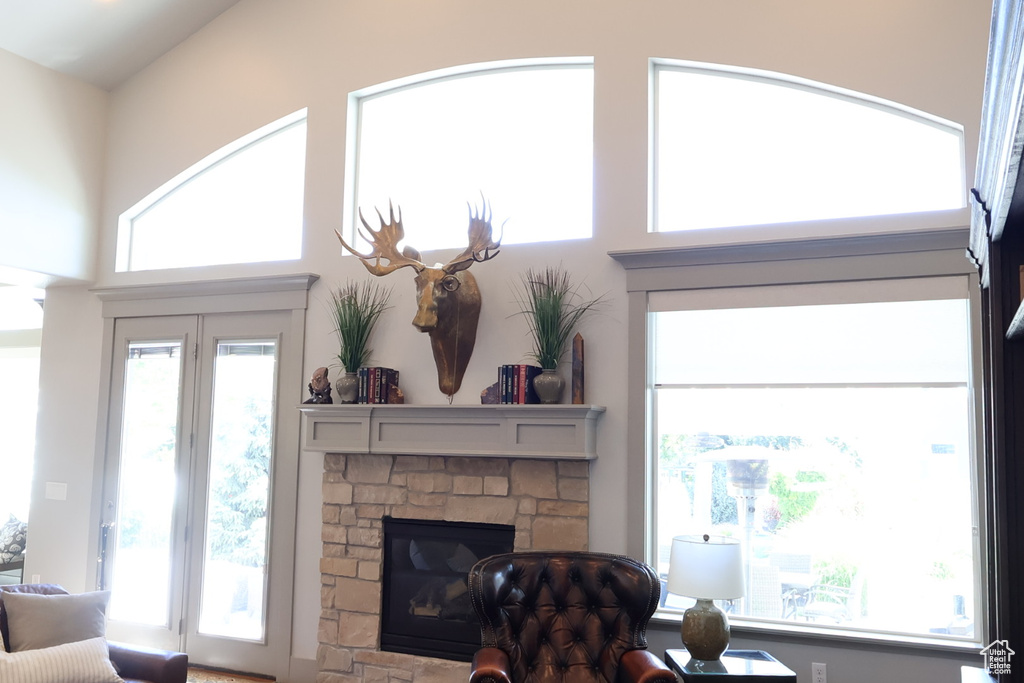 Living area featuring healthy amount of natural light and a fireplace