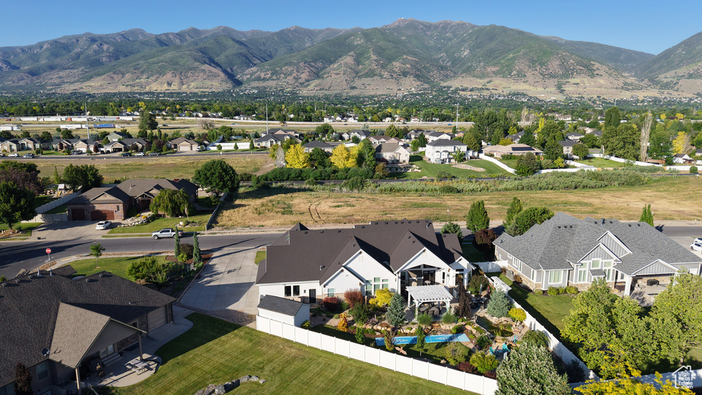Aerial view of residential area featuring a mountain backdrop