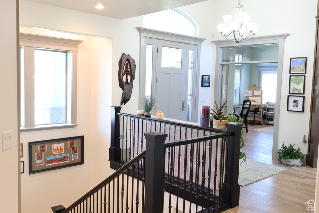 Entryway with a chandelier and wood finished floors