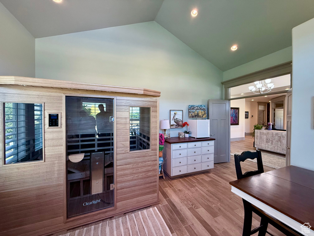 Sauna / steam room featuring recessed lighting, wood finished floors, and healthy amount of natural light