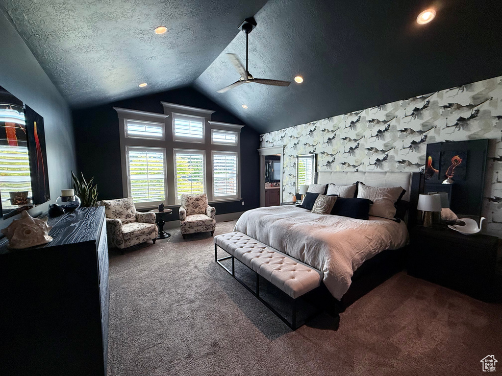 Carpeted bedroom featuring vaulted ceiling, a textured ceiling, recessed lighting, and ceiling fan