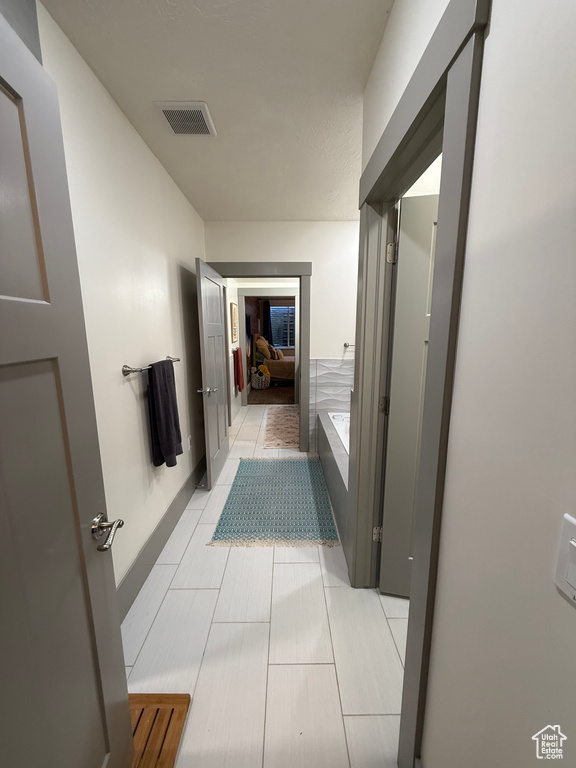 Bathroom featuring tile patterned flooring