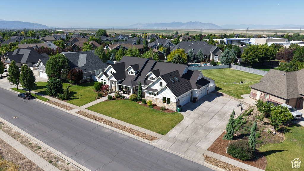 Aerial perspective of suburban area featuring a mountain backdrop