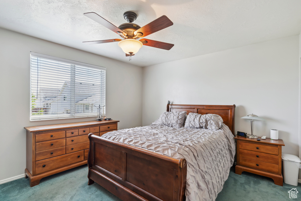 Bedroom with carpet and ceiling fan