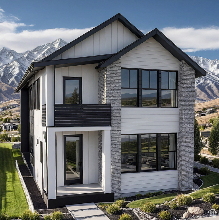 View of front of home featuring a mountain view