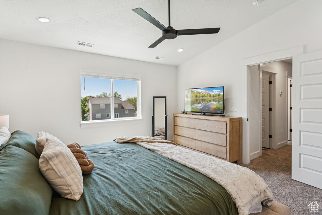 Carpeted bedroom featuring recessed lighting and a ceiling fan