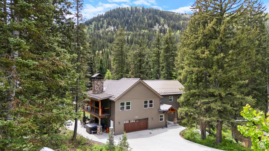 Mountain view featuring a heavily wooded area