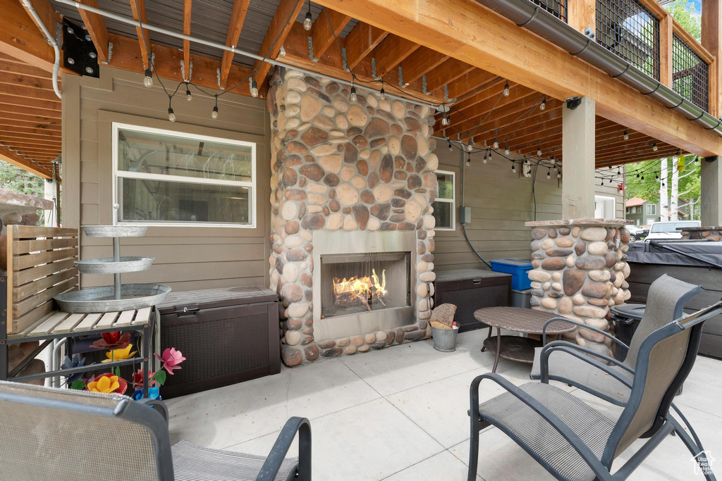 View of patio / terrace with an outdoor stone fireplace