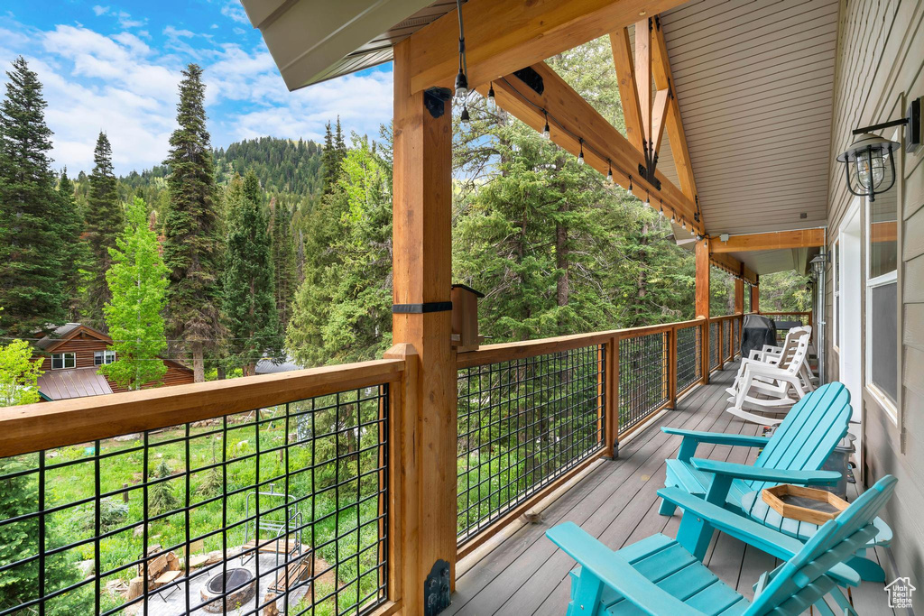 Deck featuring a wooded view