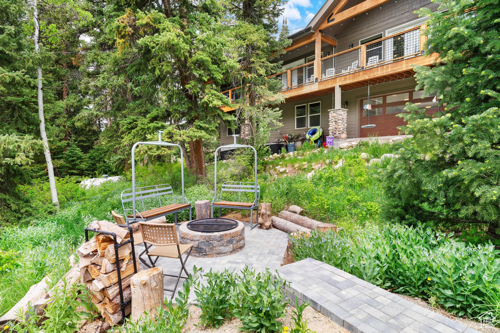 View of patio / terrace with an outdoor fire pit