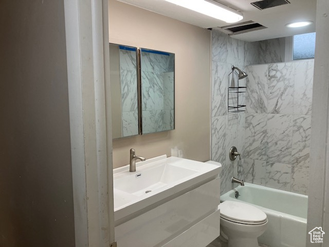 Bathroom with shower / washtub combination, toilet, and vanity