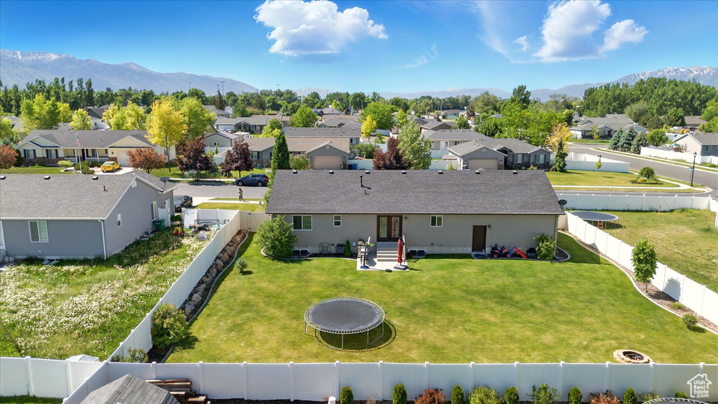 Aerial perspective of suburban area featuring a mountain backdrop