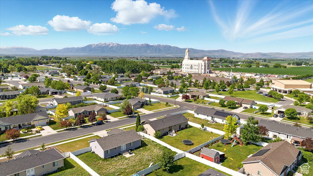 Aerial perspective of suburban area featuring a mountainous background