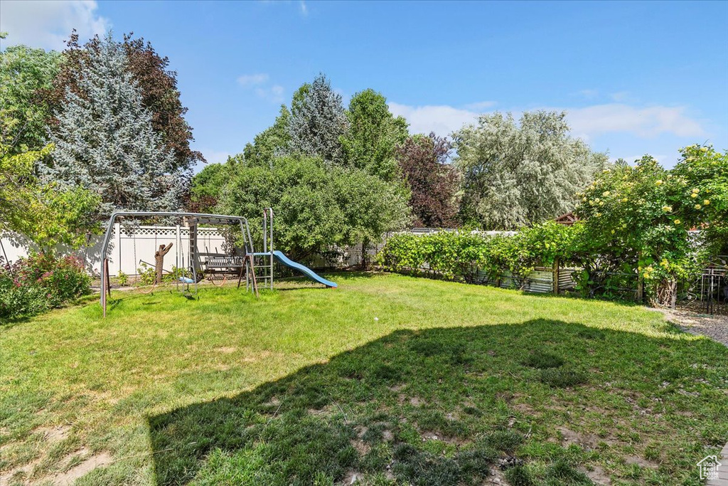 View of yard featuring a playground