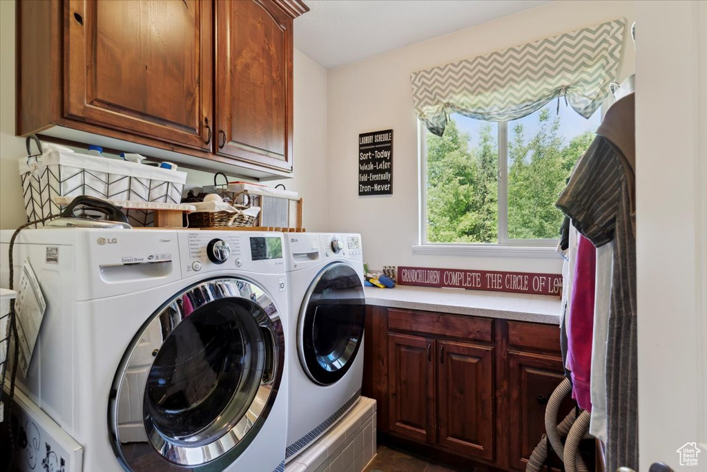 Washroom with cabinet space and washing machine and dryer