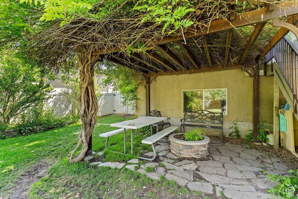 View of patio / terrace with an outdoor fire pit