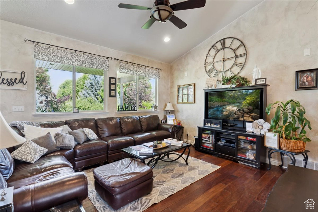 Living room featuring vaulted ceiling, hardwood / wood-style floors, a ceiling fan, baseboards, and recessed lighting