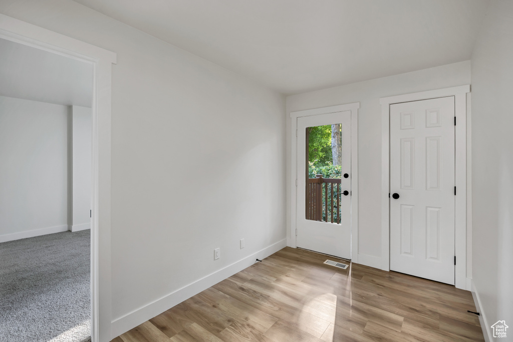 Entryway featuring baseboards and light wood-style floors