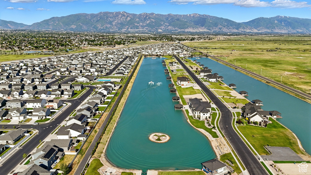 Aerial perspective of suburban area with a water and mountain view