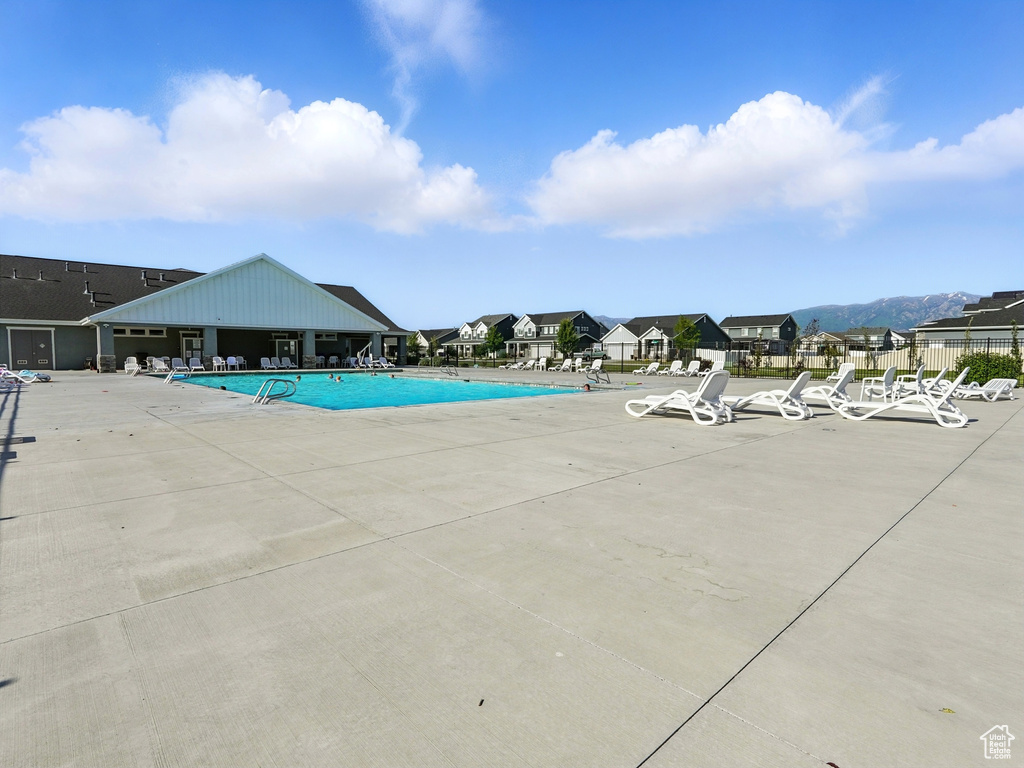 Community pool featuring a patio area