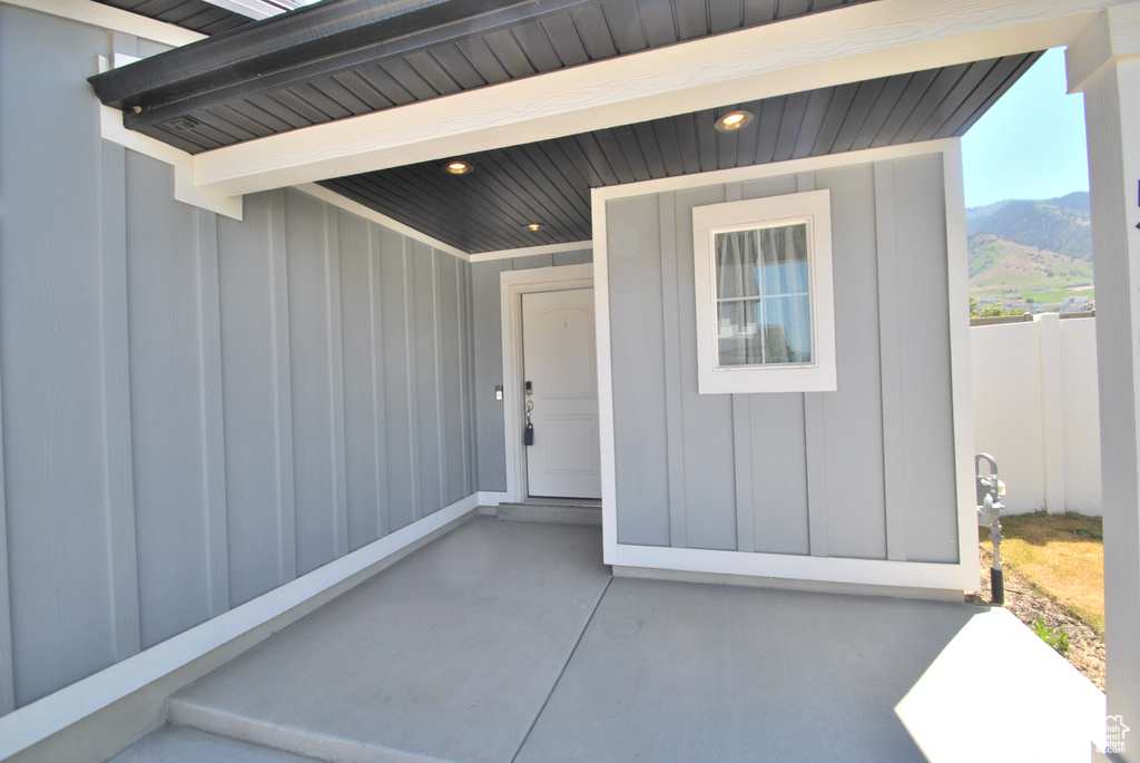 Property entrance featuring board and batten siding and a mountain view